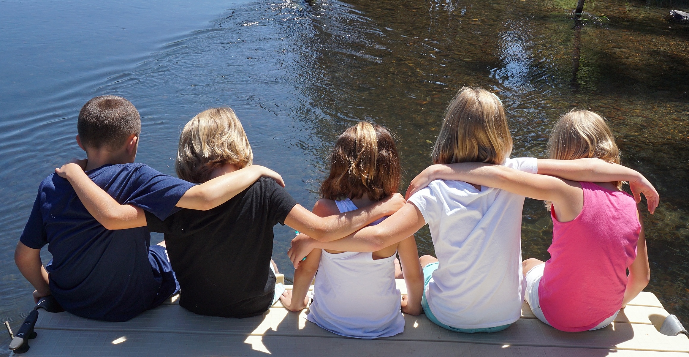 Kids by water in Summer