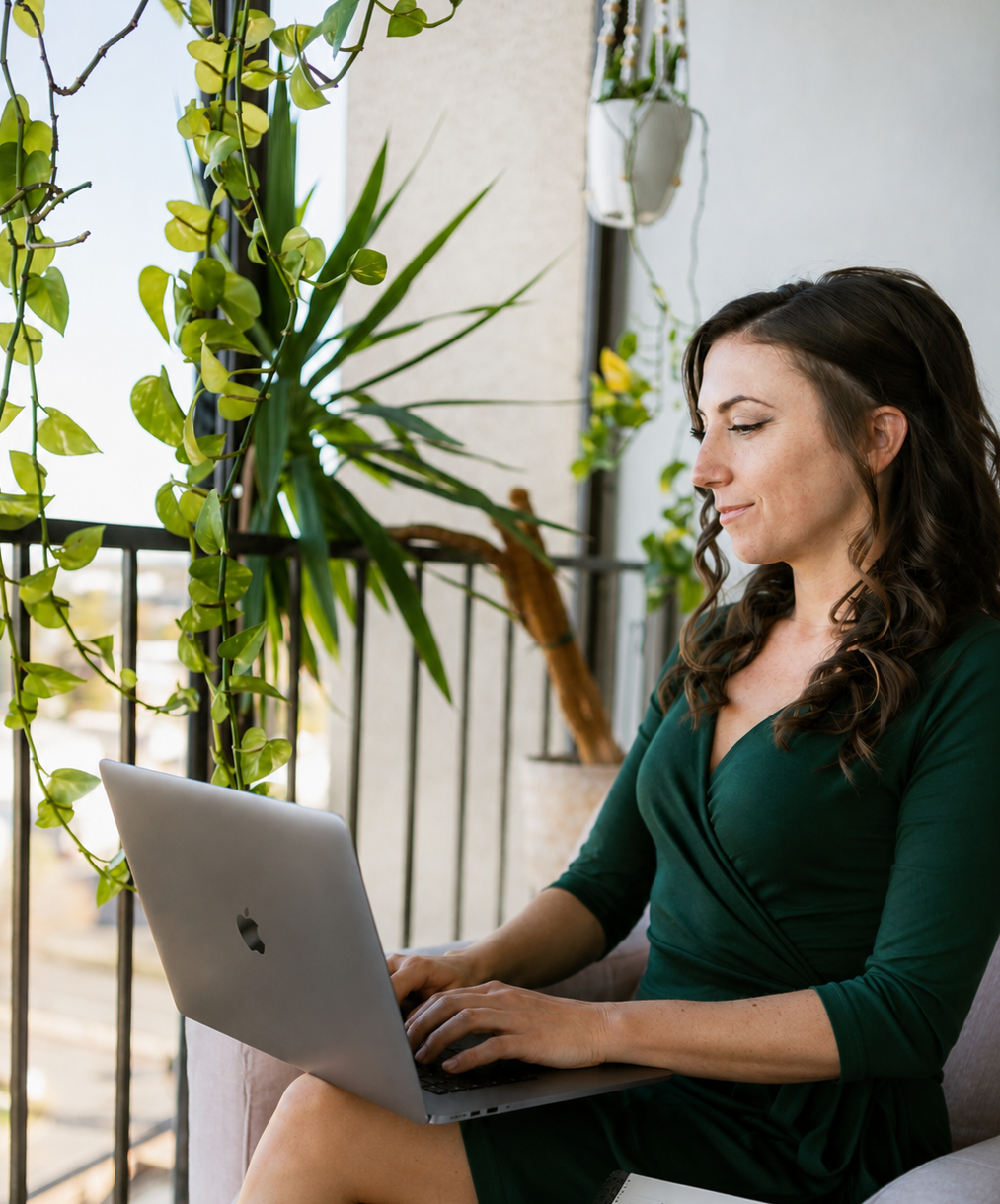 Real estate agent reviewing a home purchase offer and buyer checklist on a laptop before submitting an offer on a house.