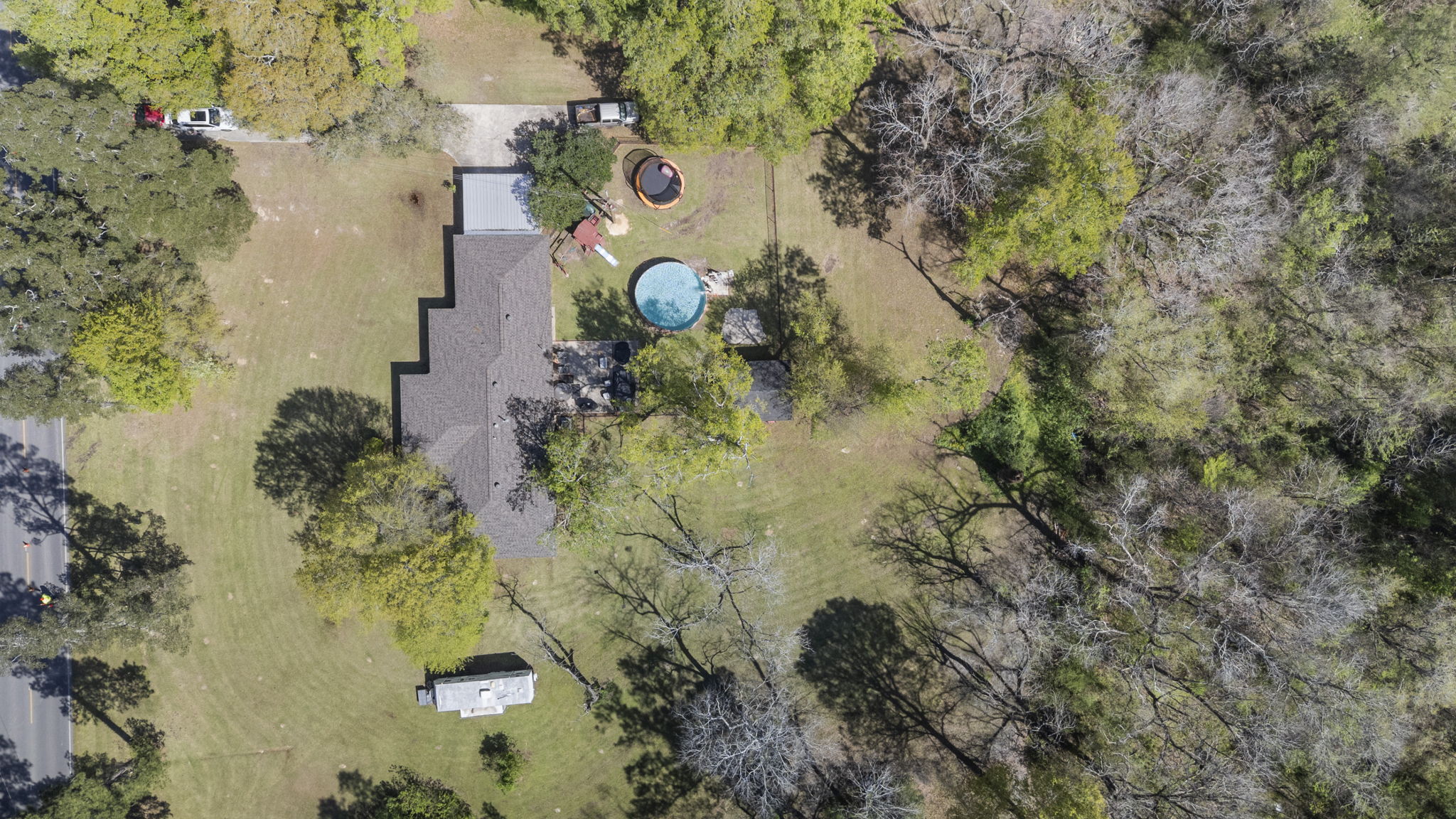 overview of home on land with a new pool and roof