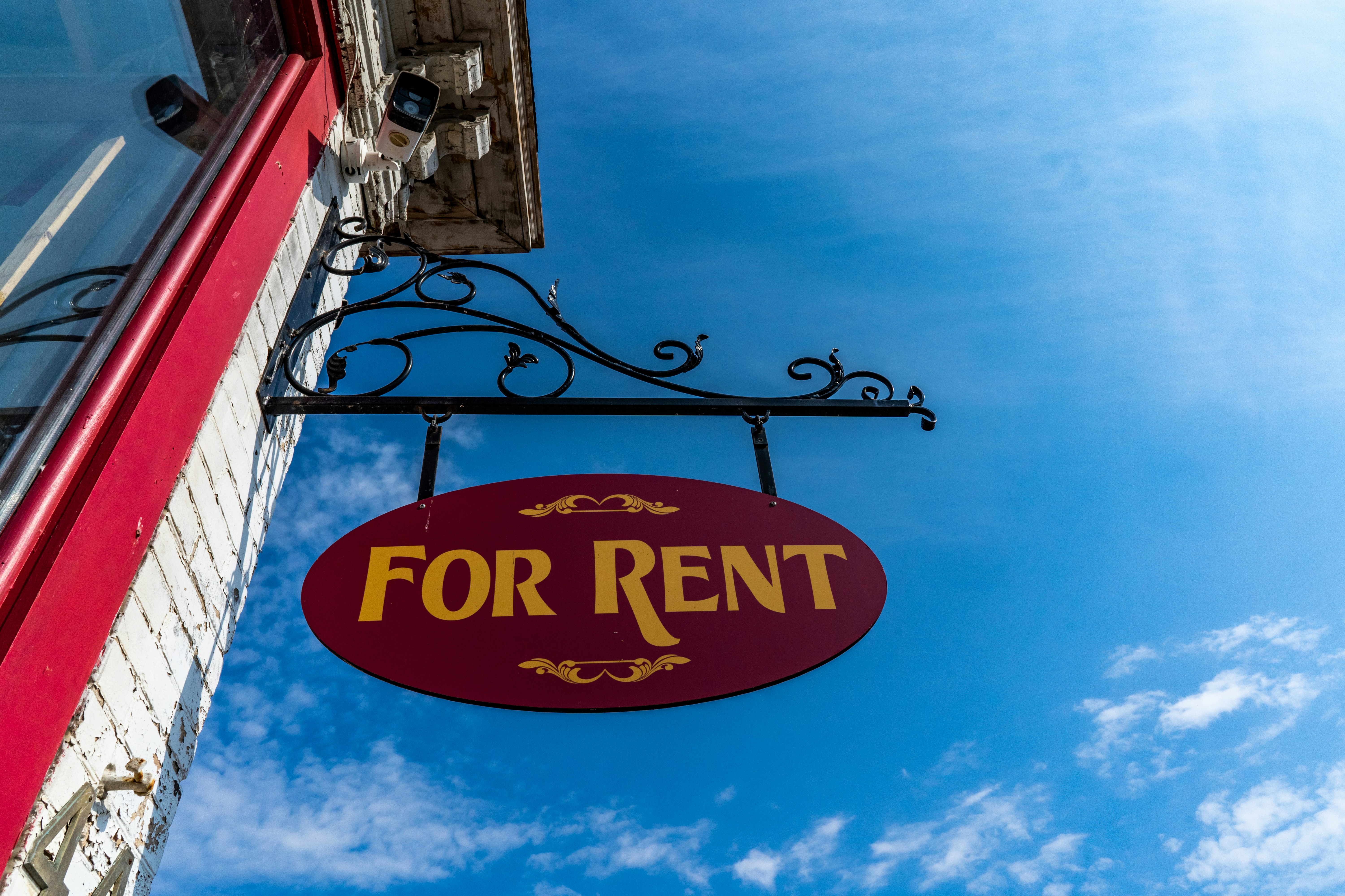 rental for rent investment red for rent sign on blue sky background