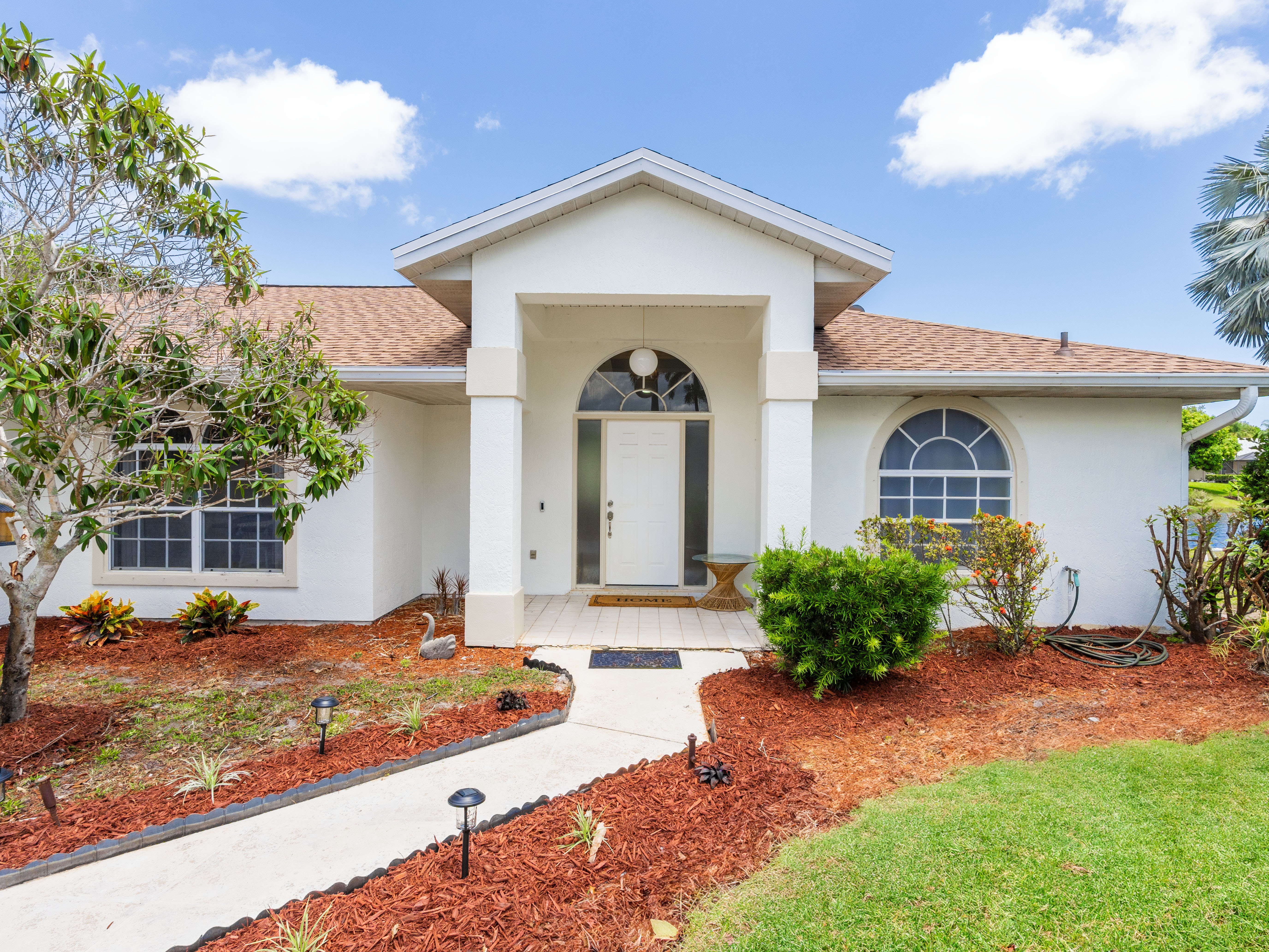 New Listing!  Lakefront + Pool Home in Palm City header image.