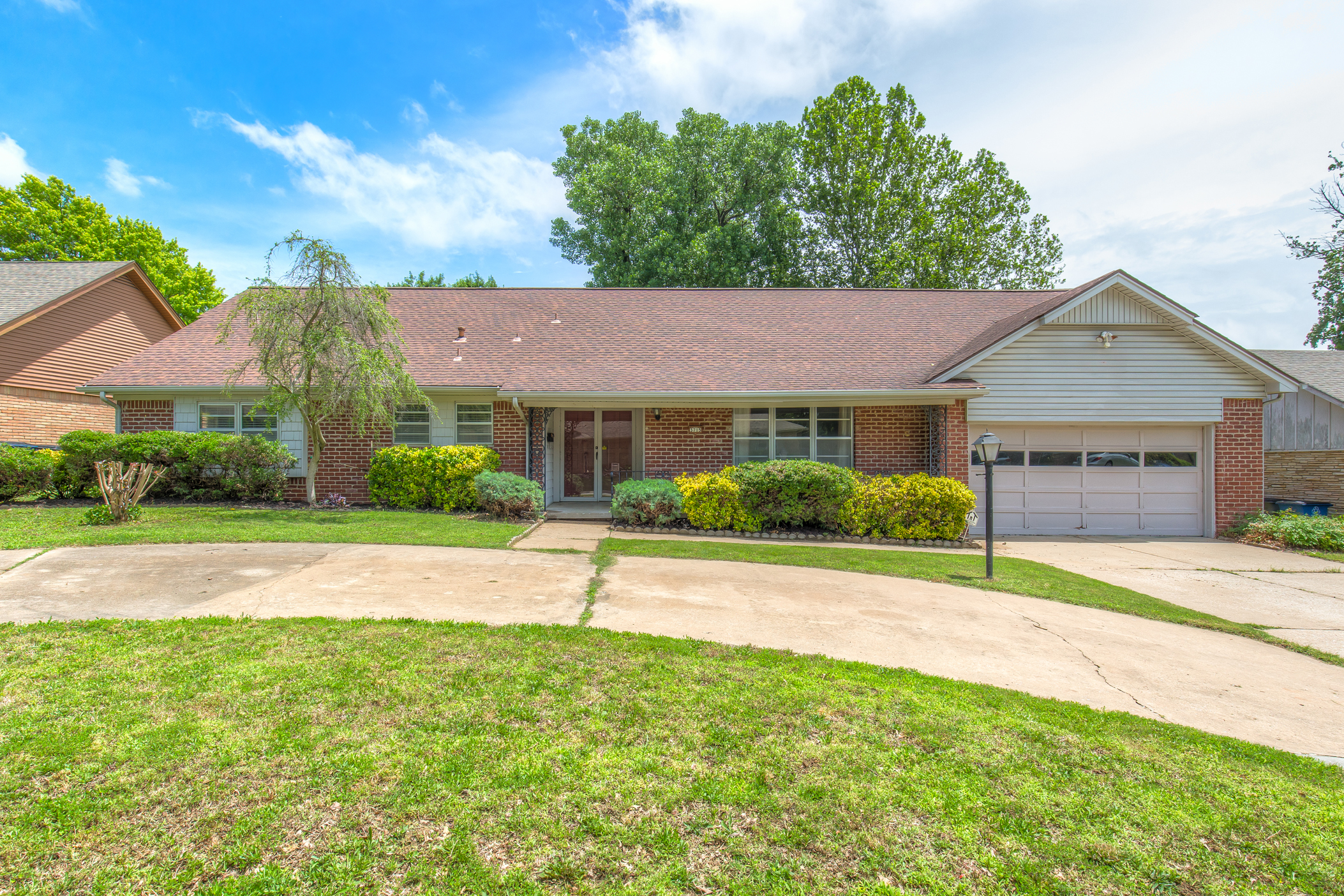 OUTSTANDING HOME with Flexible Floorplan! | The Wolek Group | Tulsa Realtor header image.