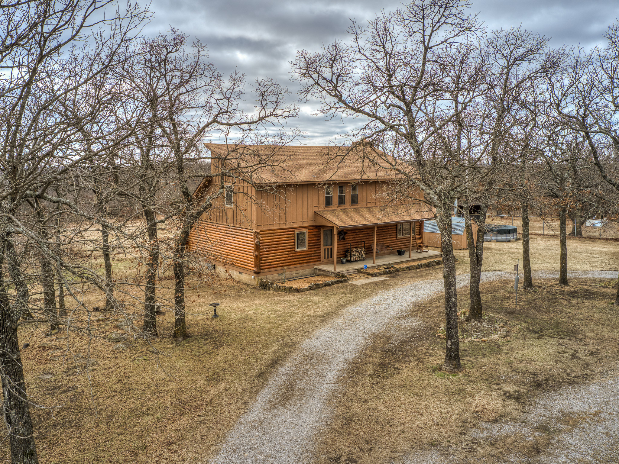 Charming Log Cabin on 30+ Acres! | The Wolek Group | Tulsa Realtor header image.