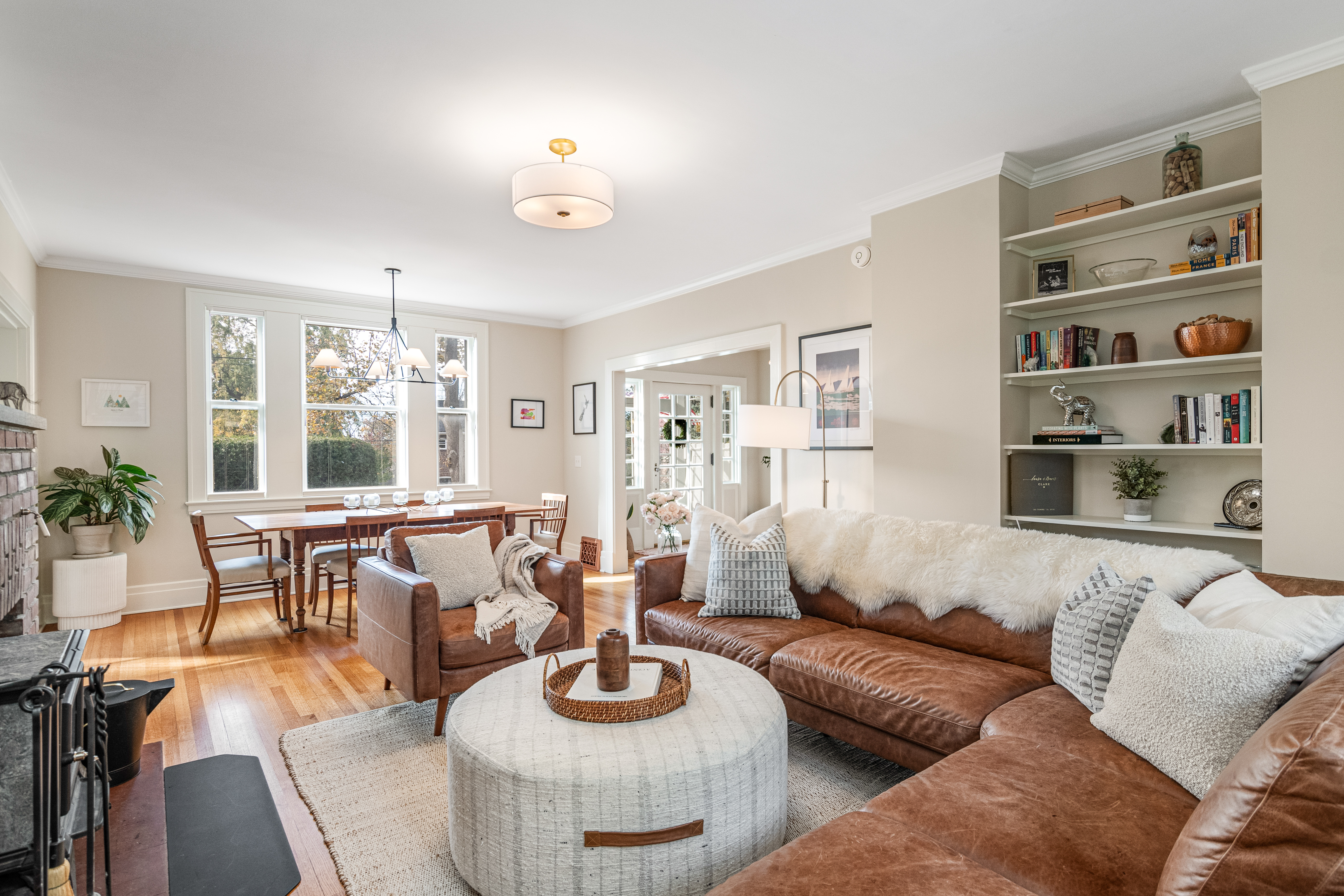 Bright and inviting living room with layered textures, neutral tones, and natural light—staged to highlight flow and functionality.