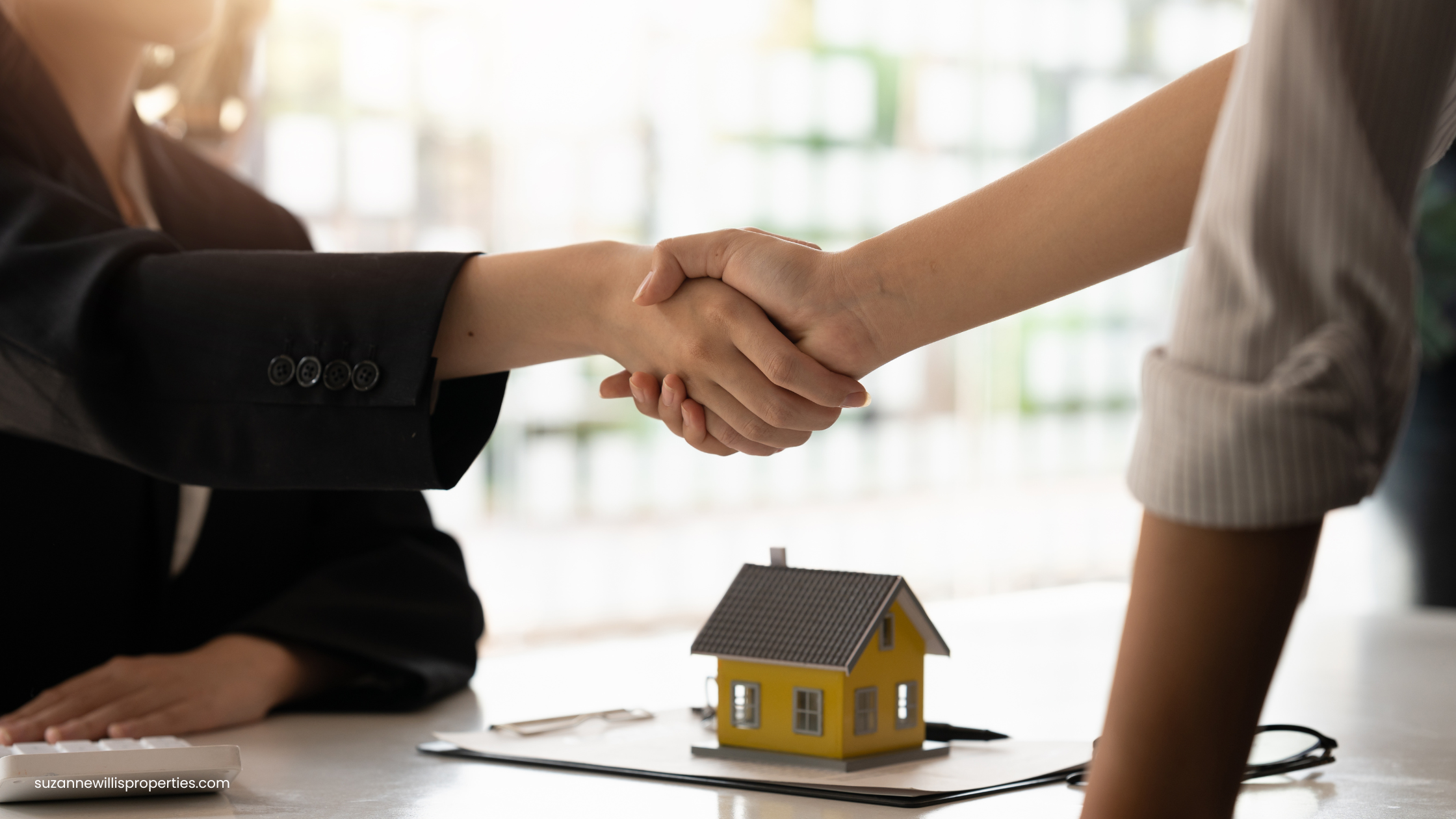 realtor and client shaking hands