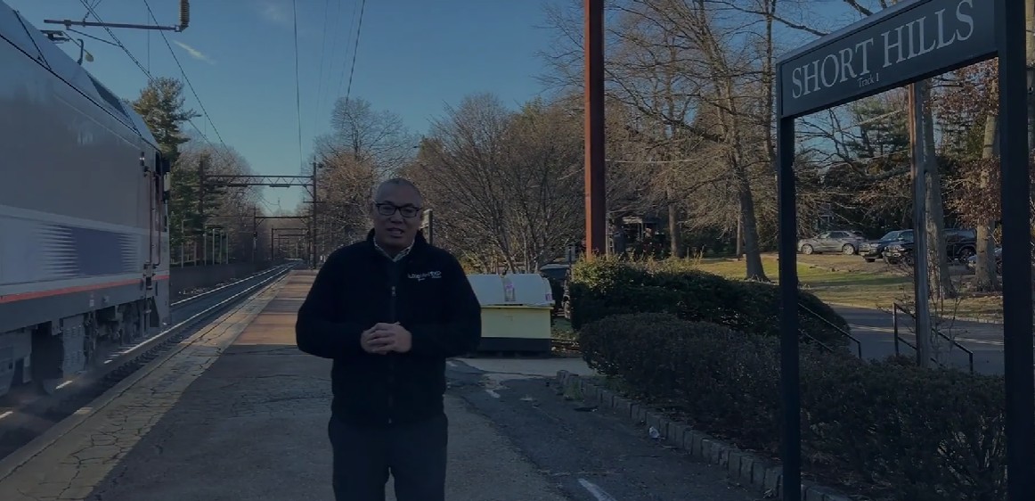Simon Westfall-Kwong standing at Short Hills Train Station, highlighting convenient NJ Transit options for NYC commuters considering homes in New Jersey suburbs.