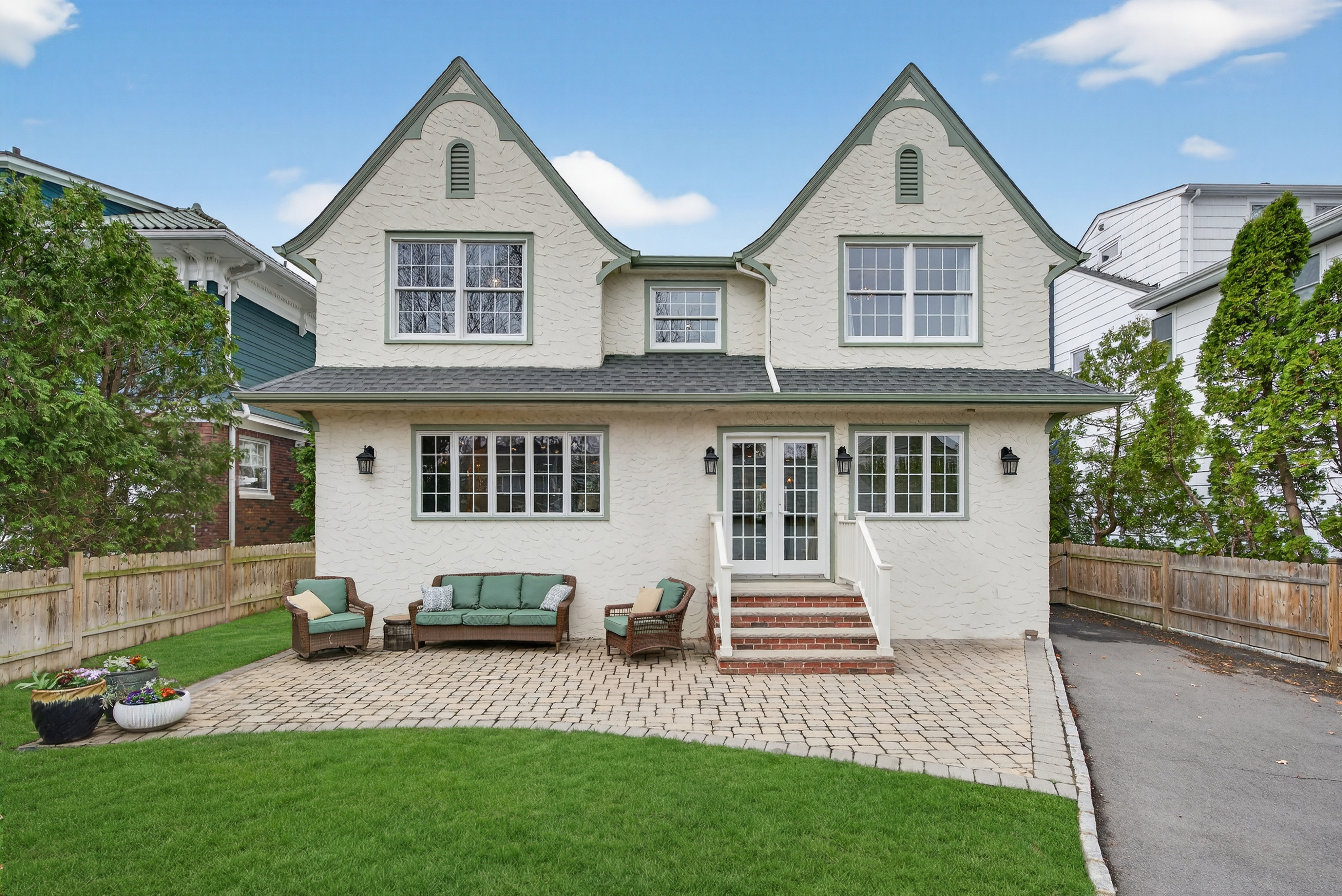 Photo of the recently sold home at 20 Parkview Dr, Millburn, NJ, showcasing a beautiful exterior with well-maintained landscaping. This listing attracted 18 offers over the asking price, exemplifying the power of a strategic pricing and home preparation approach discussed in our blog about why some homes stay longer on the market and how to avoid it.