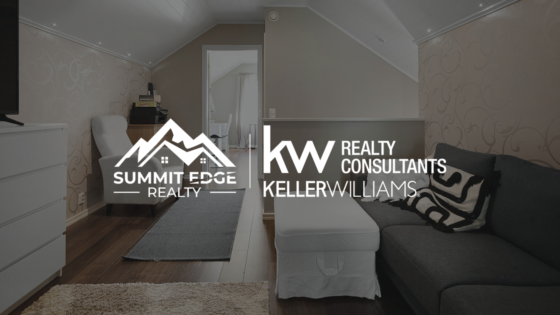 A quaint tiny home in Louisville, Kentucky, with a light gray wooden exterior, a pitched blue roof, and a small porch with a rocking chair, featuring a flower garden in front, set on a lush green yard with trees, overlaid with the Summit Edge Realty and KW Realty Consultants Keller Williams logo in white text.