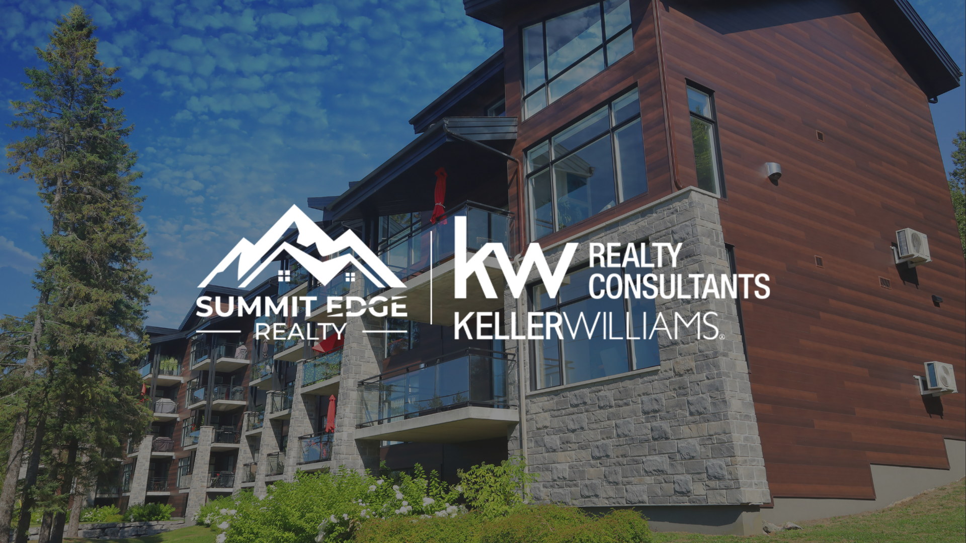 Exterior view of a Louisville, KY, multifamily housing complex with brown and gray stone walls, spacious windows, and balconies with plants, surrounded by trees, branded with the Summit Edge Realty and KW Realty Consultants Keller Williams logo in white.