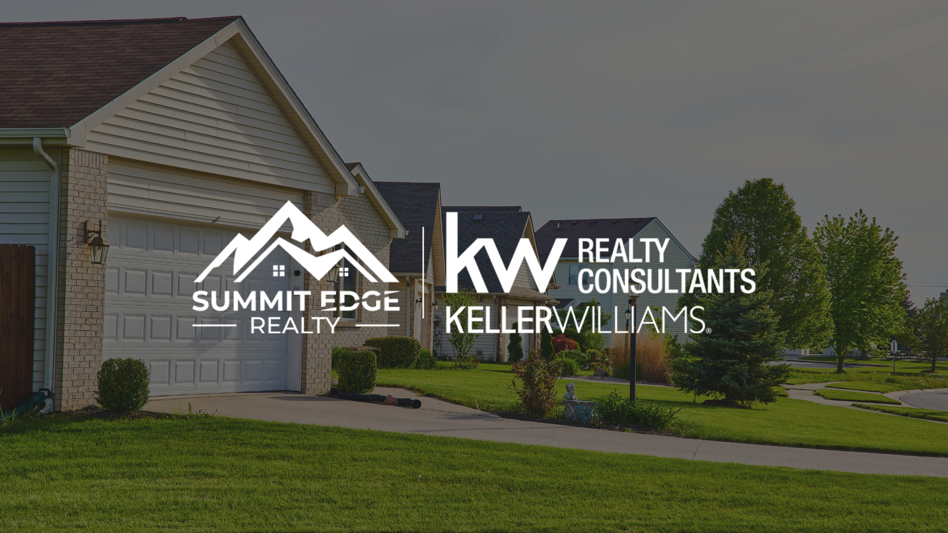 Image of an Indiana suburban community with standalone homes, tidy lawns, and decorative shrubs, with the Summit Edge Realty and Keller Williams Realty Consultants logo prominently placed.