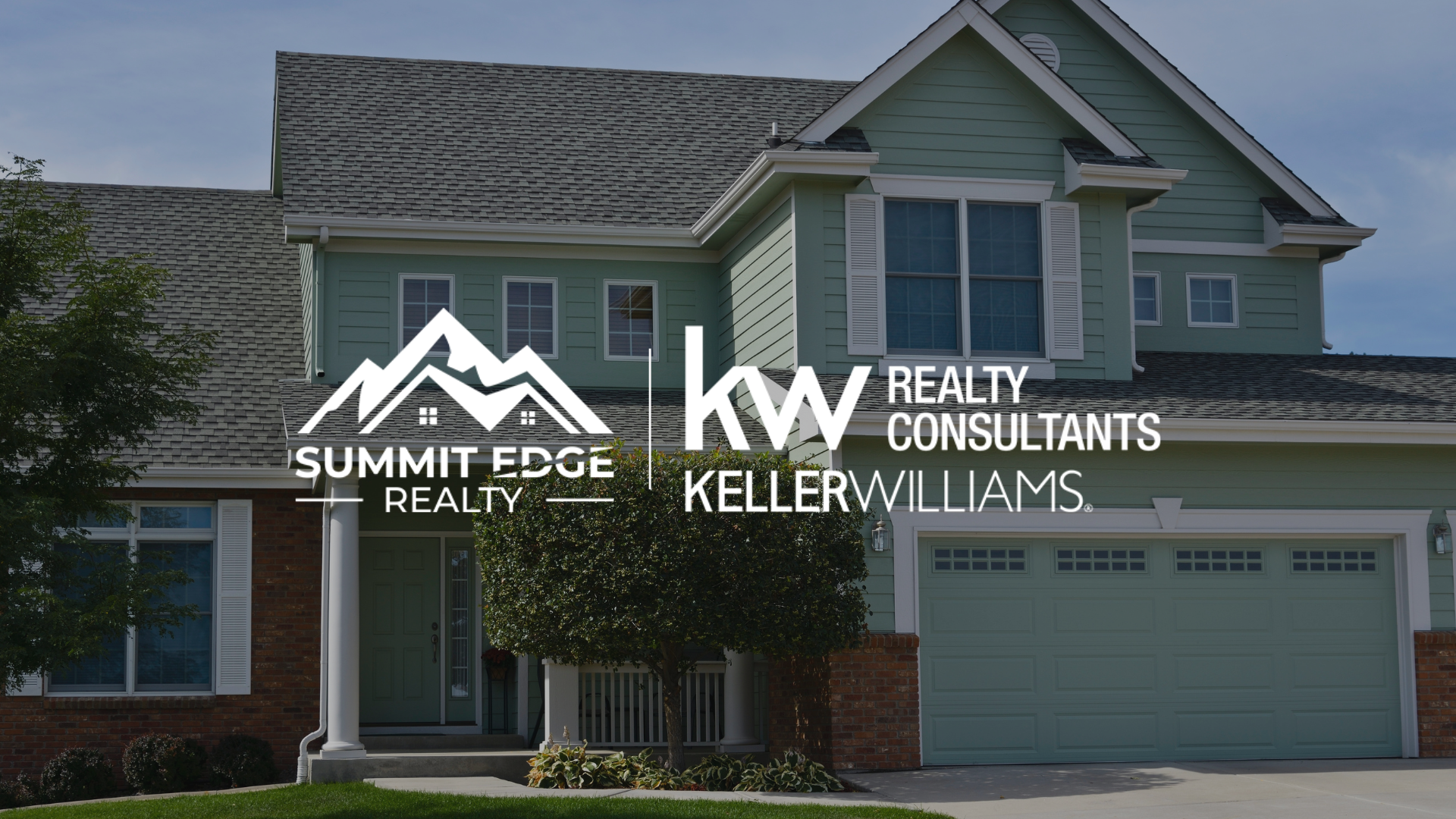 Front view of a mint green single family home with white shutters and a brick base, overlaid with the Summit Edge Realty and Keller Williams Realty Consultants branding in white text.