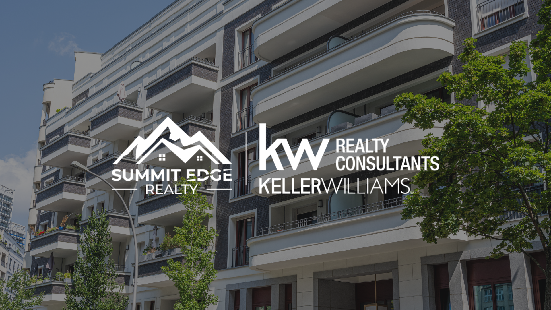 Condo exterior with Summit Edge Realty logo in foreground.