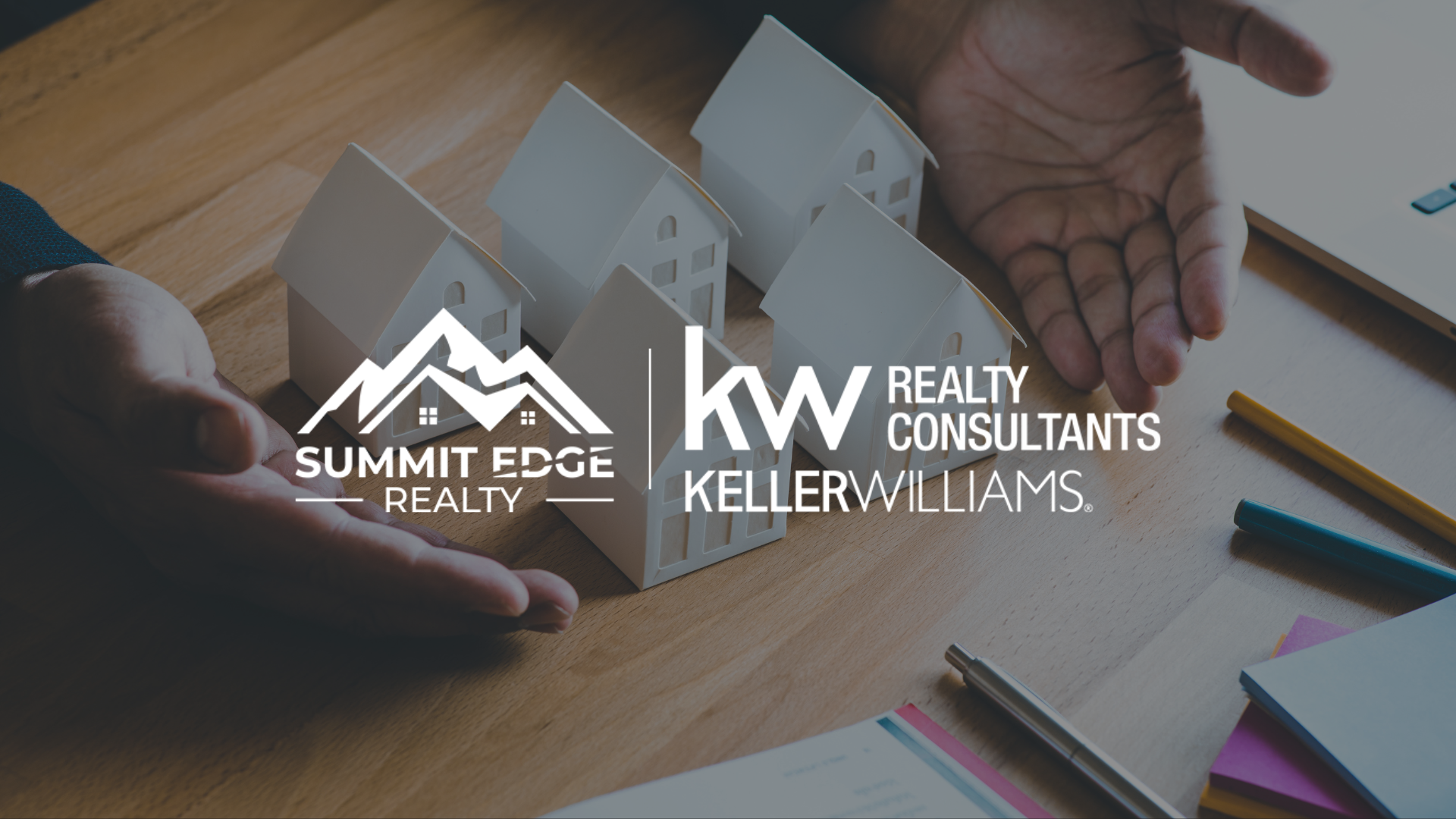 Graphic of hands with paper house models, Summit Edge Realty and Keller Williams Realty Consultants logos, plus pens and documents, highlighting real estate advisory and investment property guidance.