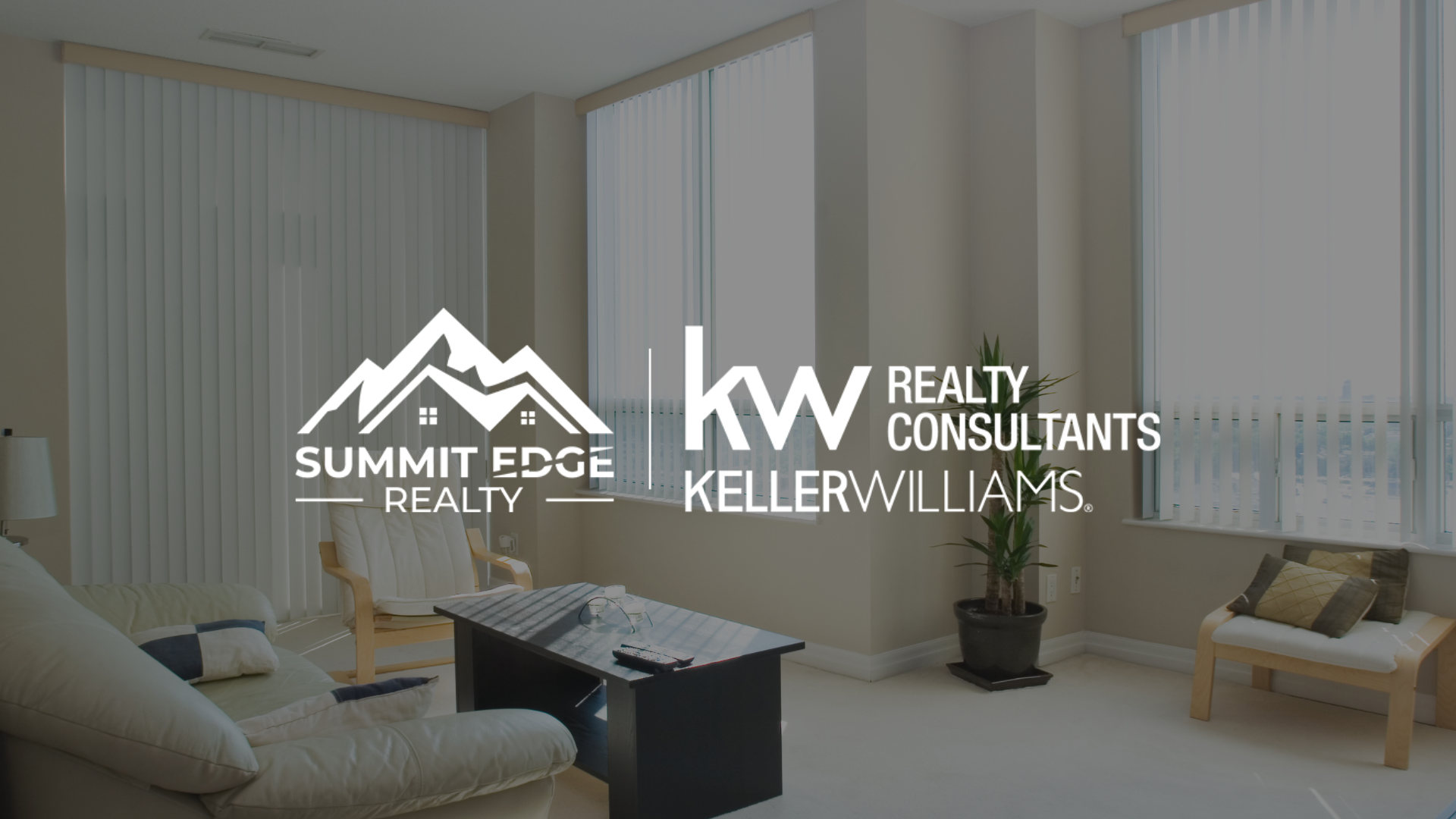 Cream colored condo living room with Summit Edge Realty logo in foreground.