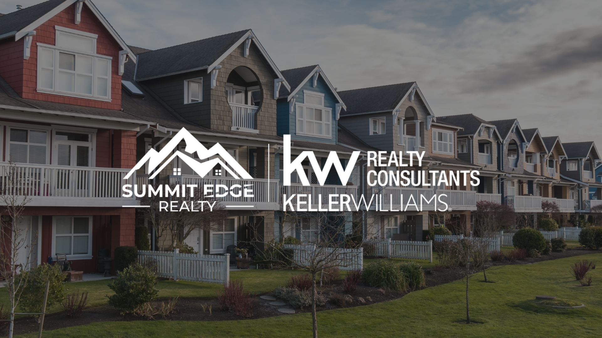 Colorful townhouse style condos with Summit Edge Realty logo in foreground.