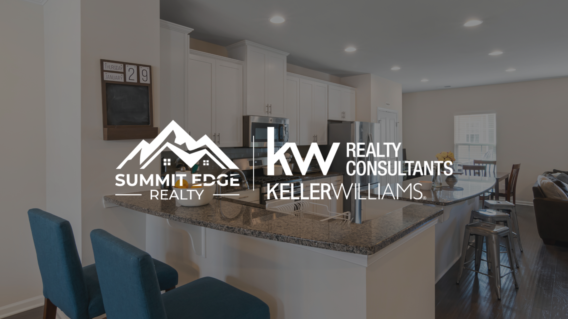 Condo kitchen with Summit Edge Realty logo in foreground.