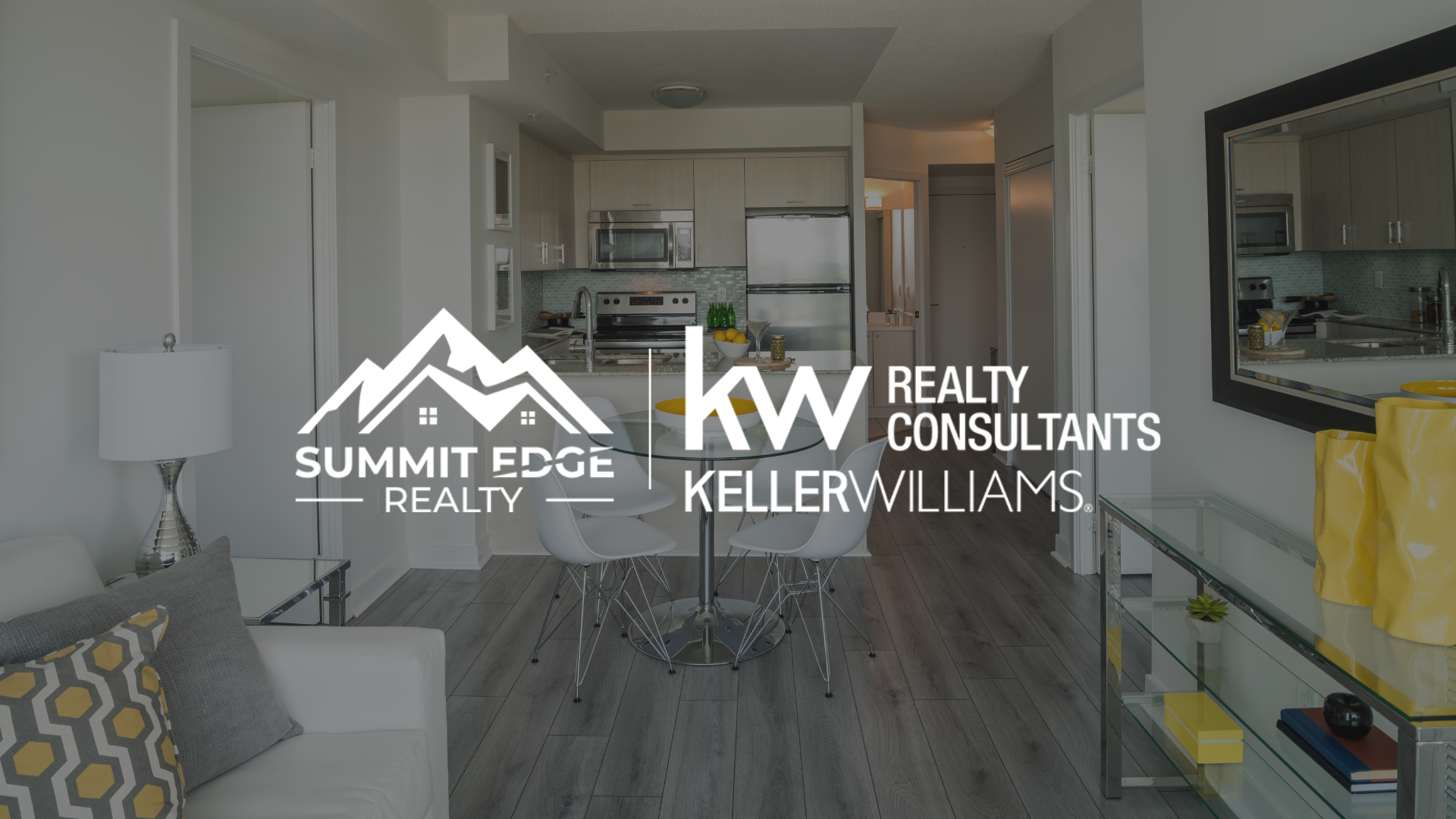 Modern condo living room with Summit Edge Realty logo in foreground.