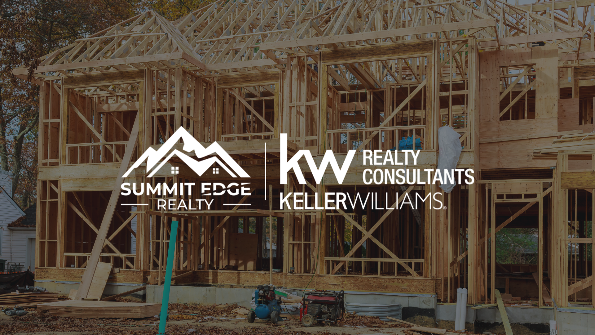 An Indiana house under construction with exposed wooden framing, featuring the Summit Edge Realty and Keller Williams Realty Consultants logo in the foreground.