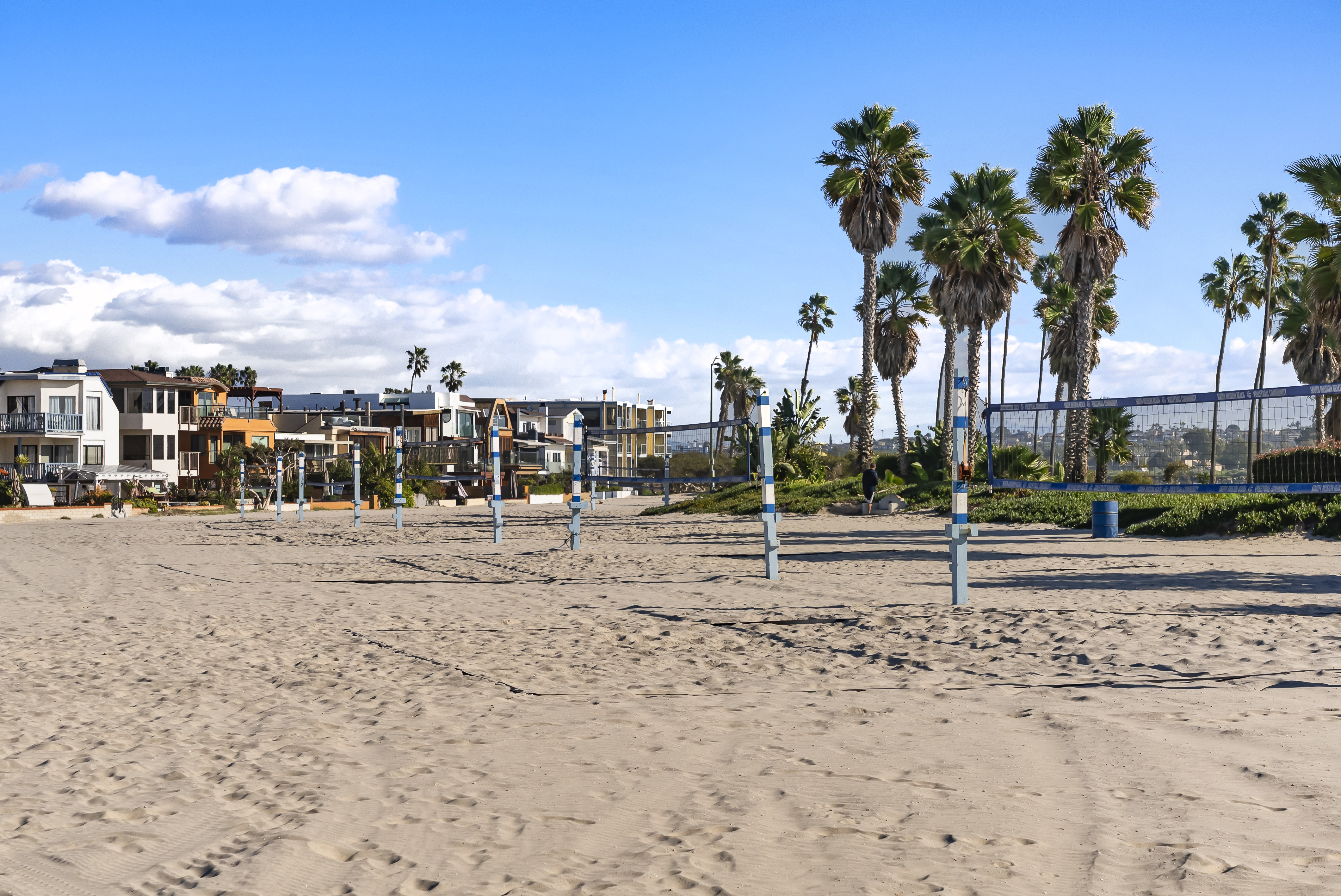 Volleyball Courts on Mission Beach in fron of Mission Beach Homes with blue sky