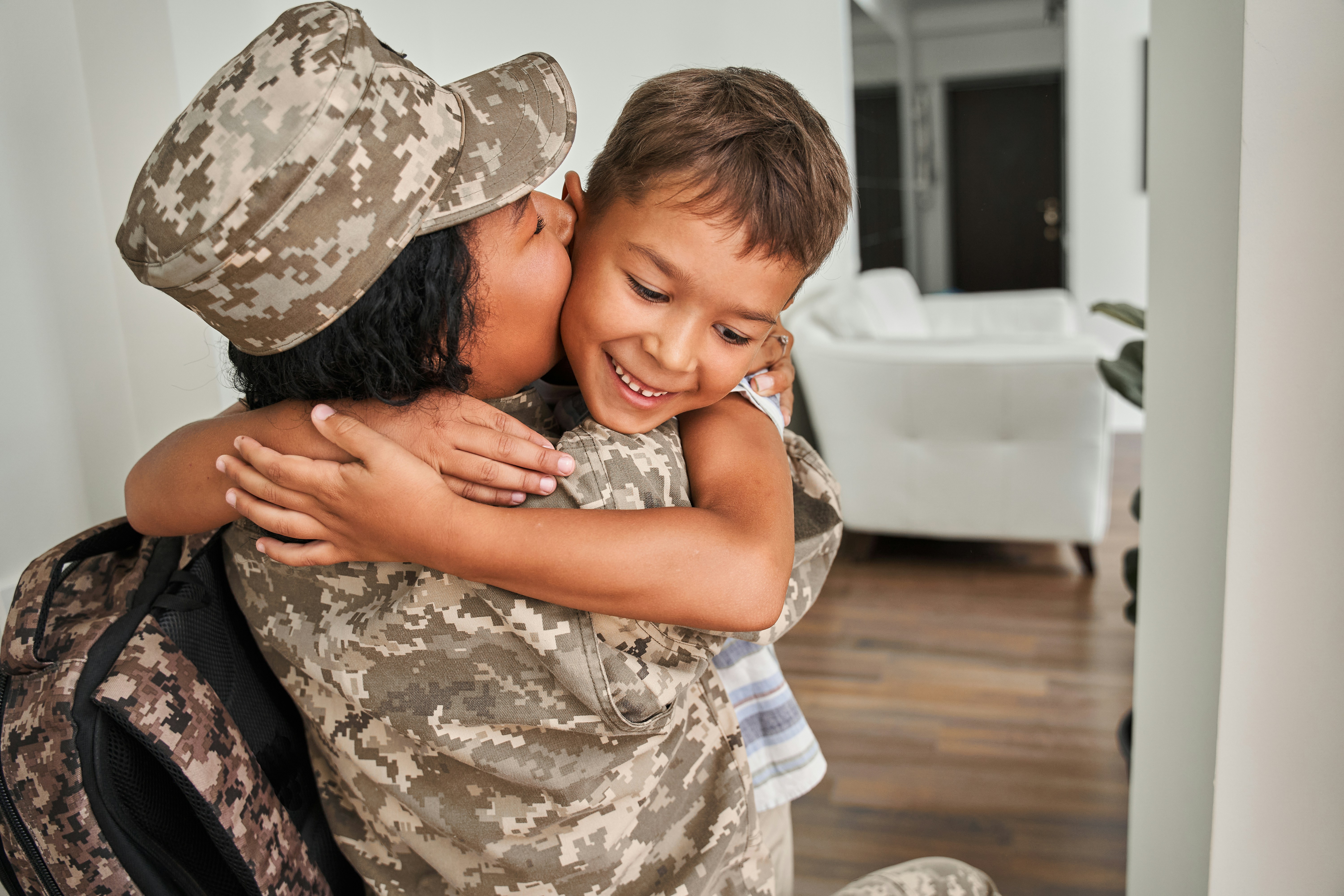 Military veteran coming home and greeting family