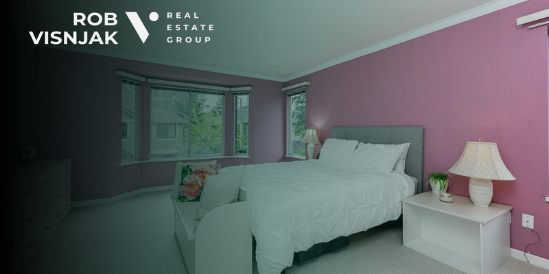 Bright bedroom with a bay window in a Surrey townhouse