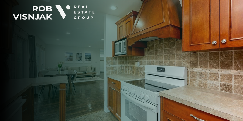 Kitchen with wood cabinets and a tile backsplash in a Langley rancher