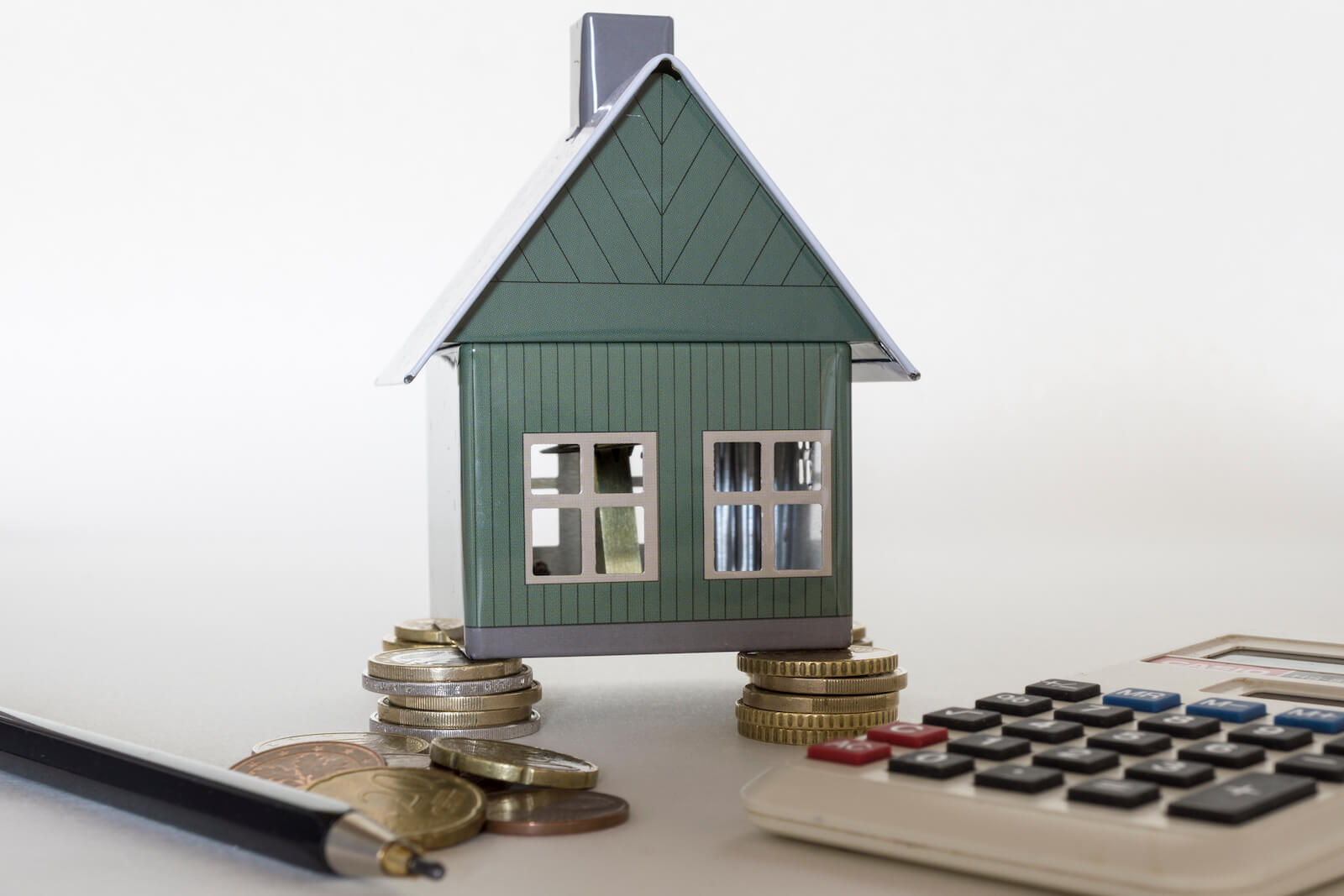 small house model stack of coins