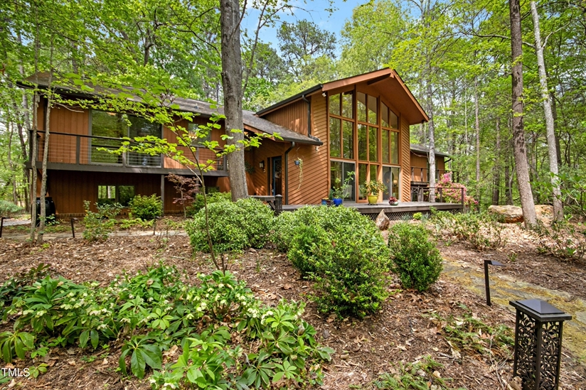 Where Modern Luxury Meets Woodland Serenity: Inside Chapel Hill's Most Enchanting New Listing at 673 Brookview Drive! header image.
