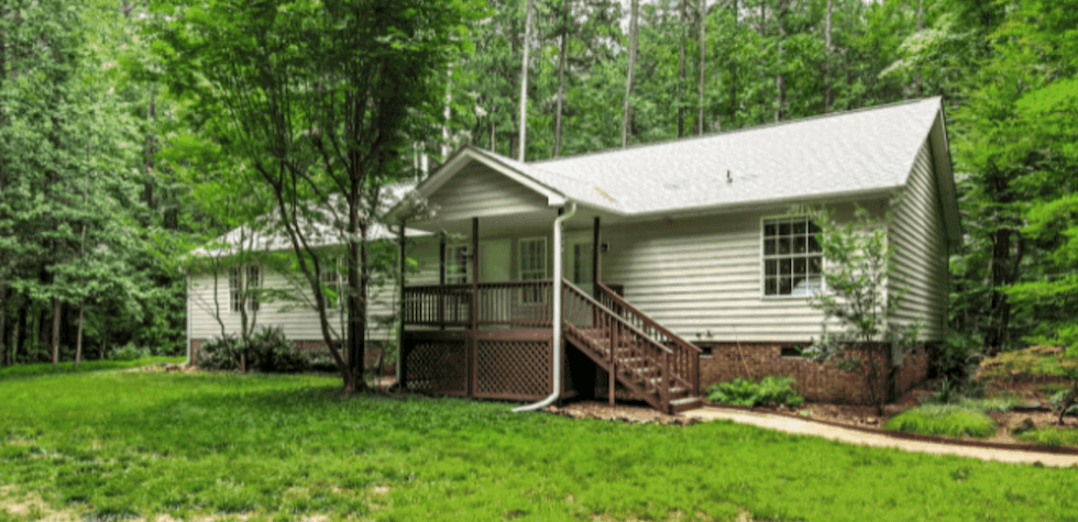 Just Listed! AMAZING home surrounded by hundreds of acres of Duke Forest! header image.