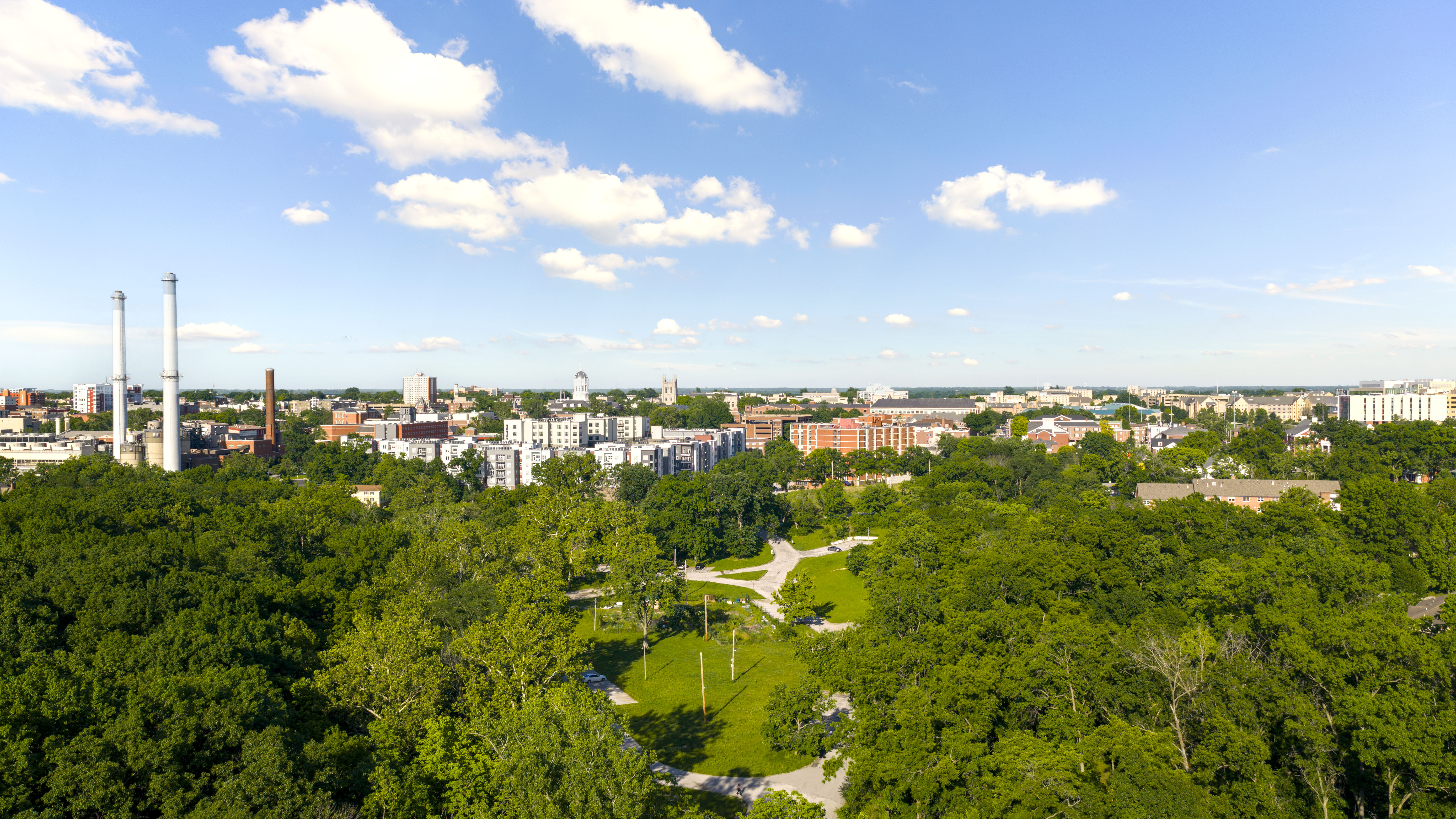 Aerial view of Columbia, Missouri, showing the skyline, neighborhoods, and University of Missouri area.