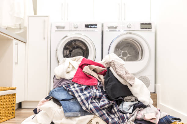 laundry in front of washer and dryer