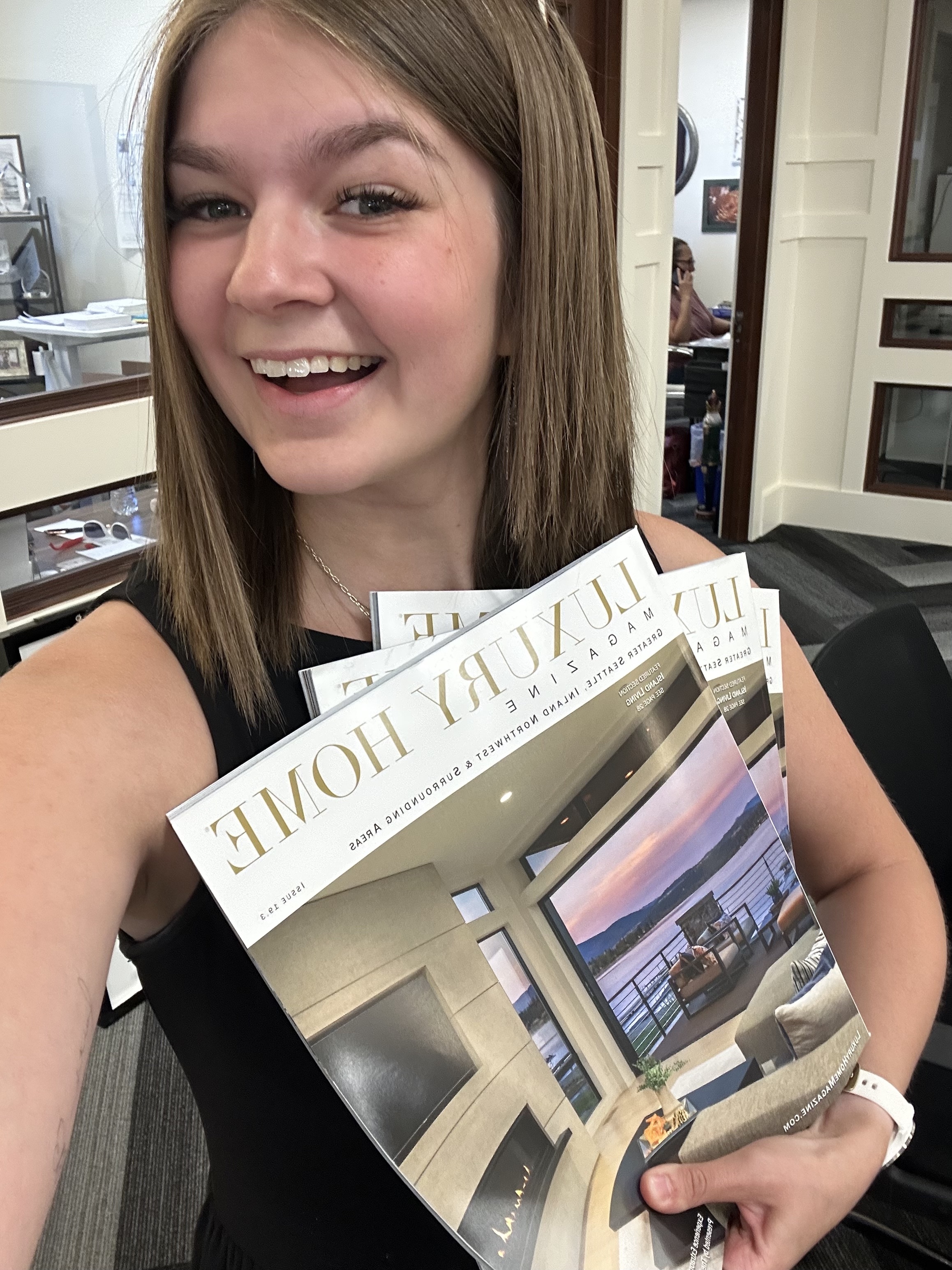 girl holding magazines
